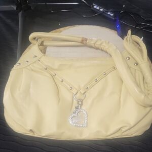 Elegant Cream Handbag with Heart Charm
